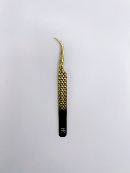 Strong Curve “Omega” Tweezer